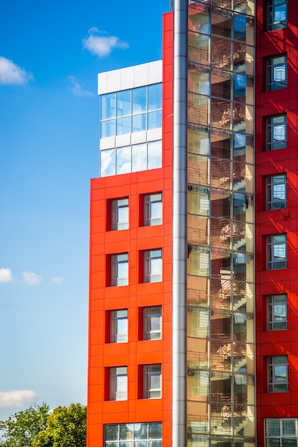 Modern building on a background of blue sky with clouds