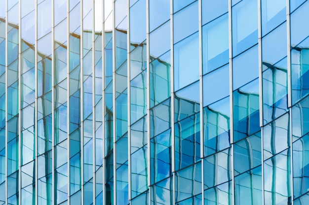 Modern building blue glass surfaces architecture background.