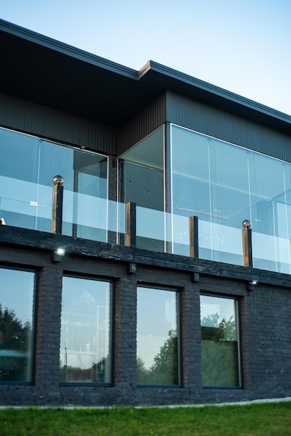 Modern building facade on village on the sunset