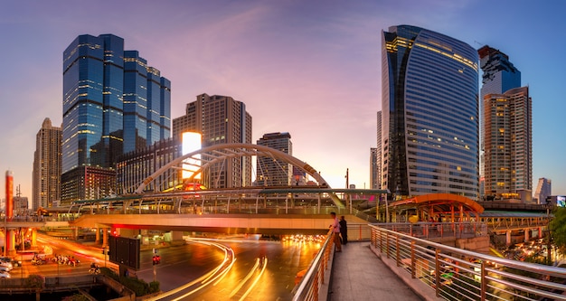 Modern building at night. Traffic in the business district The Skytrain station Chong Nonsi