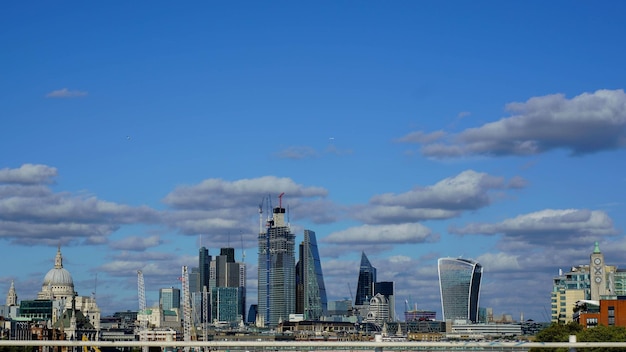 Photo modern buildings against blue sky in city