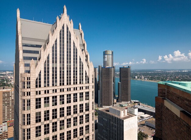 Modern buildings in city against blue sky