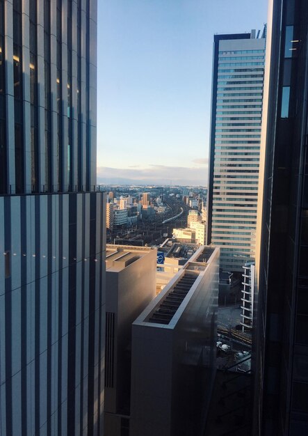 Modern buildings in city against clear sky