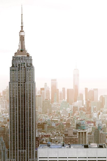 Modern buildings in city against clear sky