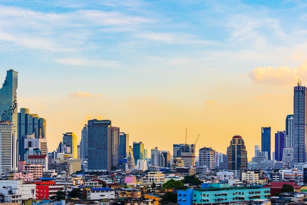 Photo modern buildings in city against sky during sunset