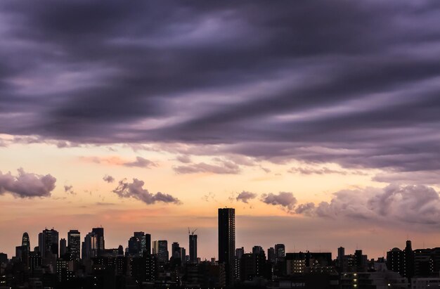 Photo modern buildings in city against sky during sunset