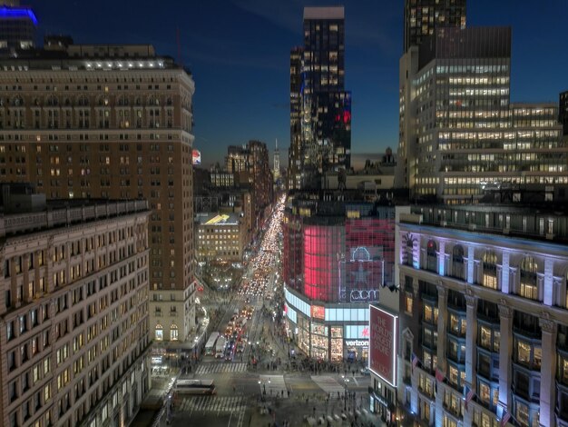 Modern buildings in city against sky at night