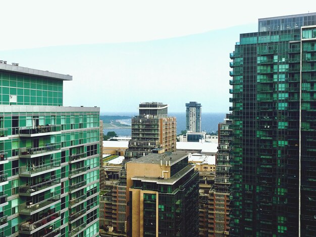 Modern buildings in city against sky