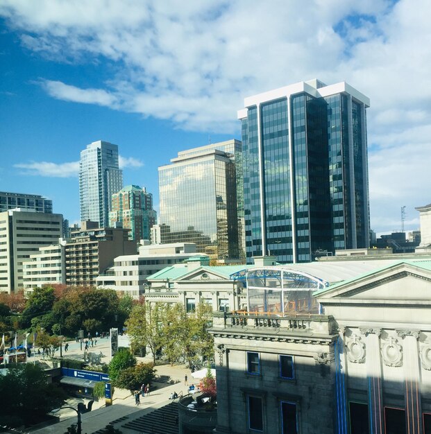 Modern buildings in city against sky