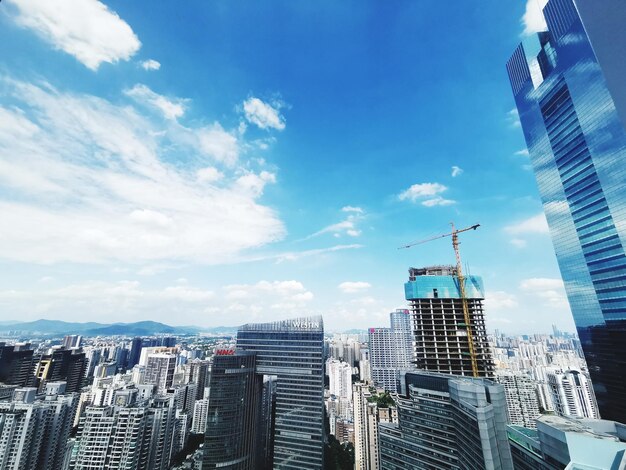 Modern buildings in city against sky