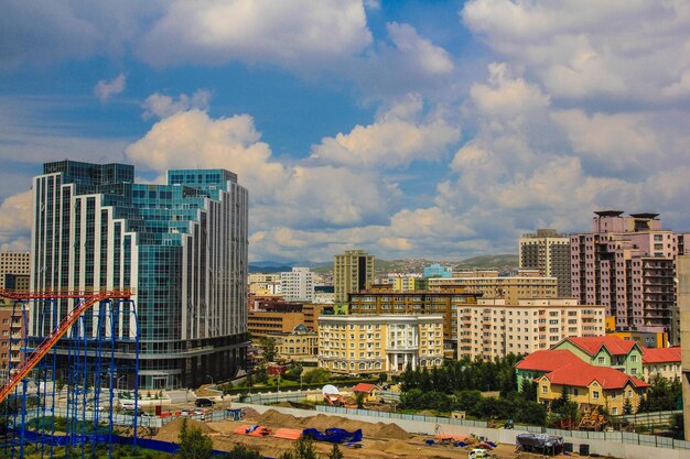 Modern buildings in city against sky