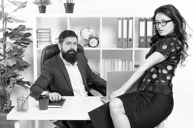 Modern business couple working in modern office Businesspeople Formal fashion dress code Business couple in modern office collaboration Man with beard and sexy woman Modern life