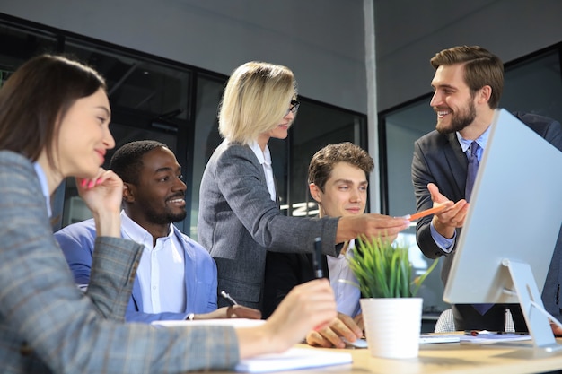 Modern business people discuss the new project at office.