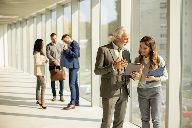 Modern business people using digital tablet in the office