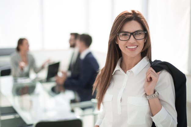 Modern business woman on the background of the officephoto with copy space