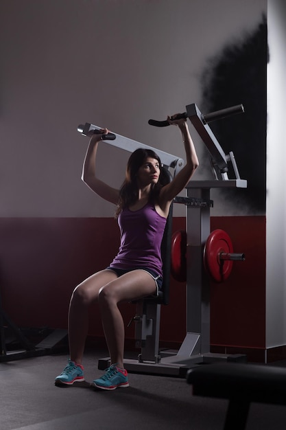 Modern business woman at a fitness lesson in a modern fitness club