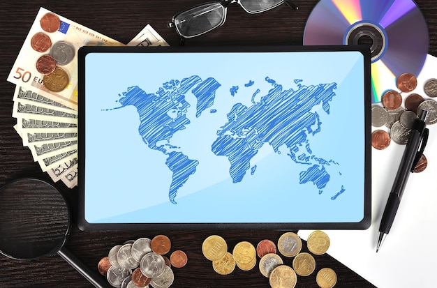 Modern business workplace tablet with world map