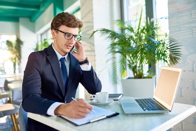 modern businessman speaking by phone