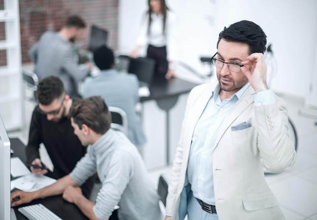 Modern businessman standing in officethe concept of success