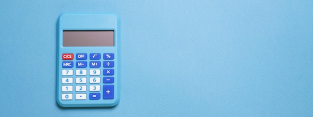 Modern calculator business and financial accounting concept on blue background