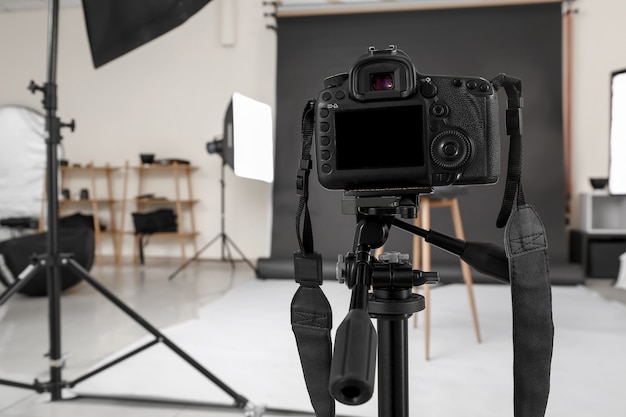 Modern camera in professional photo studio