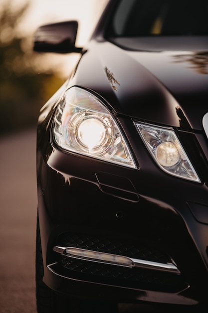 Modern car close up detail on one of the headlights.