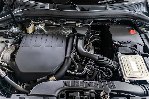 Modern car engine under hood close up detail