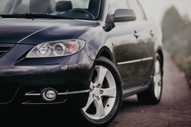 Modern car front headlight with wheels