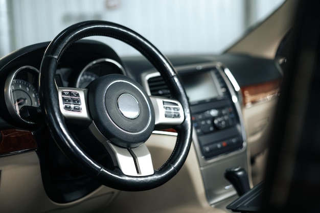 Modern car interior steering wheel and dashboard