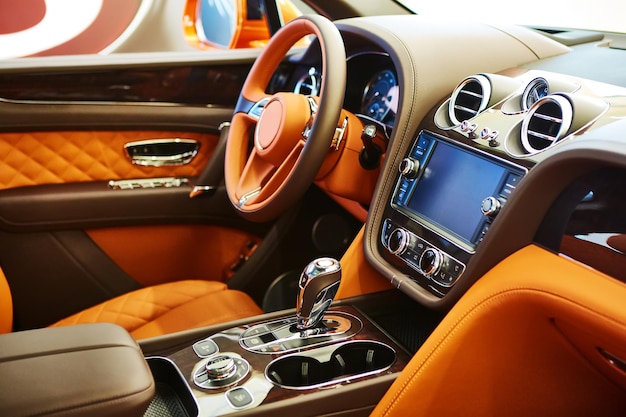 Modern car interior with leather panel, multimedia and dashboard