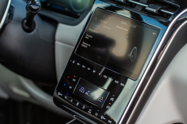 Modern car media display in the interior of the car. Touchscreen monitor on the dashboard of the modern car.