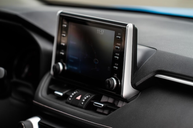 Modern car media display in the interior of the car. Touchscreen monitor on the dashboard of the modern car.