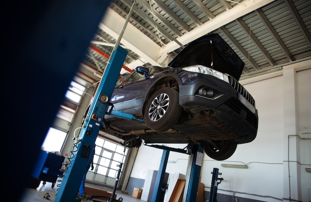 Modern car repair station with a large number of lifts and specialized equipment for diagnostics and service repair car