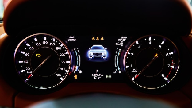 Modern car speedometer and illuminated dashboard