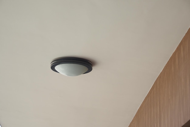 a modern ceiling light fixture enhances the aesthetic of a minimalistic interior design space