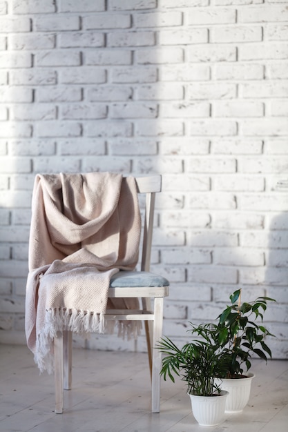 Modern chair in white room interior parquet wood floor.