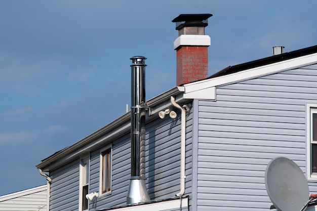 Modern chimney on the roof roofing