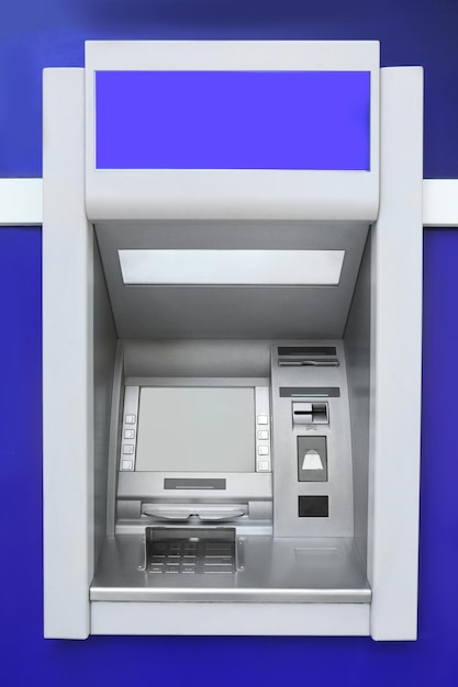 Photo modern color automated teller cash machine outdoors