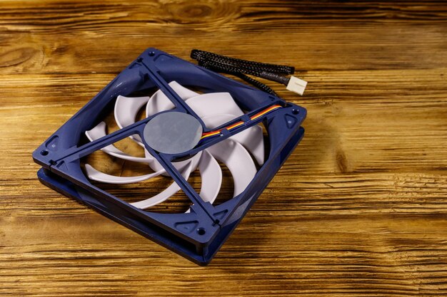 Modern computer fan on a wooden desk