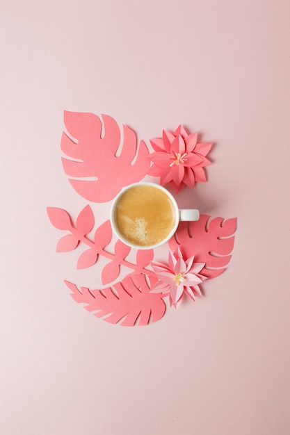 Modern concept of romantic morning breakfast - cup of coffee espresso and origami papercraft flowers