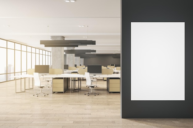空白の白いモックアップ ポスターを備えたモダンなコンクリートと木製のコワーキング オフィス インテリア