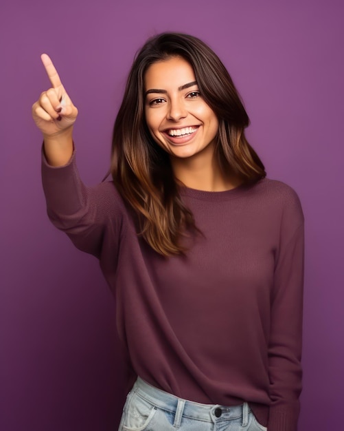 A modern cool smiling woman pointing with her hand in front view photography