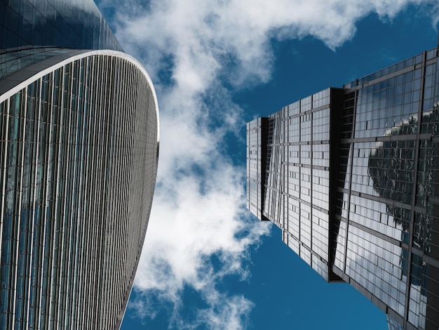 Modern corporate buildings against blue cloud sky