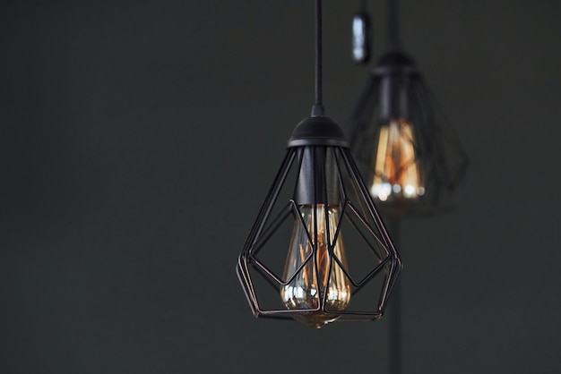 Modern designed light bulbs hangs on the wall indoors Decoration and domestic life