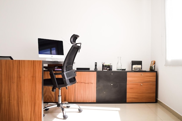 Modern designer desk for office business and creative spaces Wooden desk in black color with storage drawers