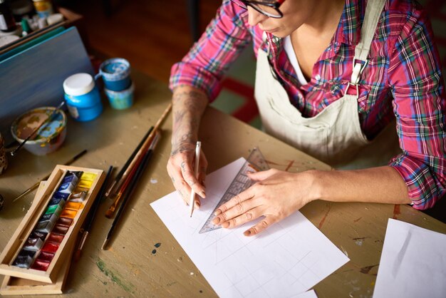 Modern Designer Working at Wooden Table