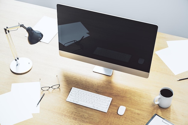 Modern desktop with empty black computer screen