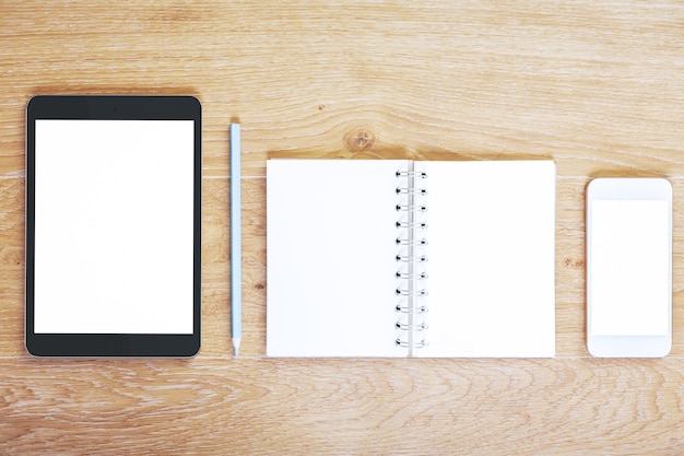 Modern desktop with empty tablet and smartphone