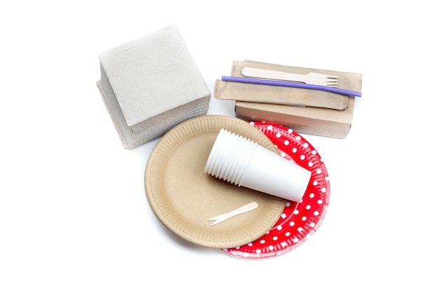 Modern disposable ecofriendly tableware and napkins on a white background