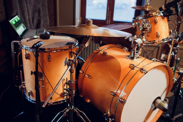 Modern drum set on stage prepared for playing.